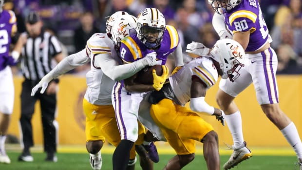 Nov 20, 2021; Baton Rouge, Louisiana, USA; LSU Tigers running back Tre Bradford (8) runs with the ball against Louisiana Monroe Warhawks during the first half at Tiger Stadium. Mandatory Credit: Stephen Lew-USA TODAY Sports